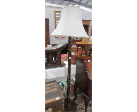 A standard lamp with shade.