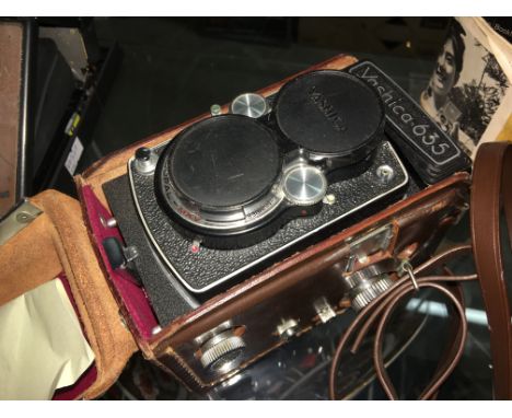 A cased Yashica 635 camera.