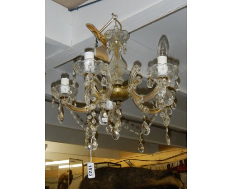 A 5 lamp glass chandelier.
