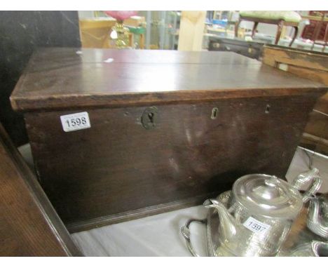 A 19th century trunk with candle box.