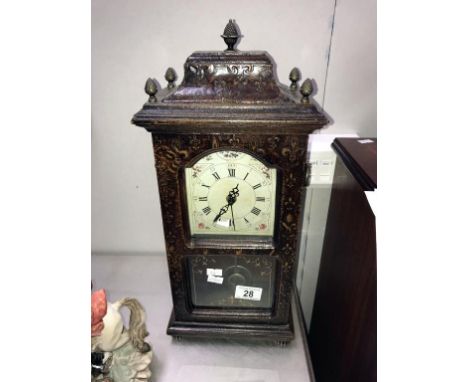 A tall mantel clock.