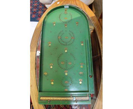 A Chad Valley green finished bagatelle board.
