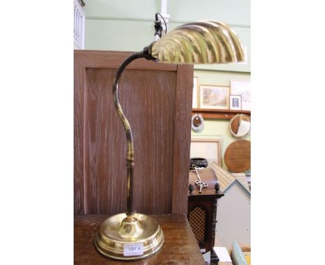 A brass table lamp, with scallop shade