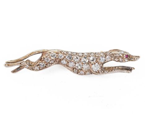 An antique pave-set diamond and ruby dog brooch, Est. Dia. Wt. 0.50ct, length 4.2cm, Wt. 4.8g, in a case.  