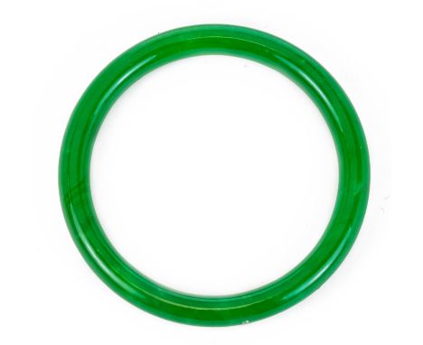 A carved jadeite bangle, width 8cm, Wt.36.6g. 