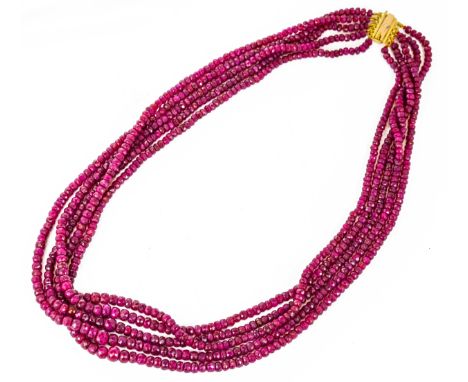 A five row ruby bead necklace, length 57cm, Wt. 90.4g. 