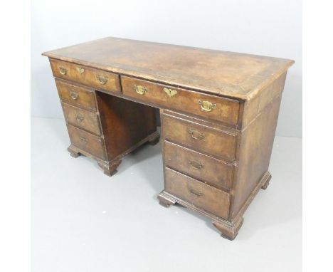 A 19th century mahogany and burr walnut veneered twin pedestal writing desk, with eight drawers and bracket feet. Overall 138