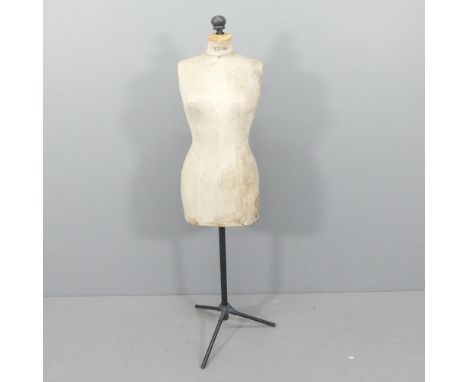 A vintage dressmaker's mannequin on metal stand, labelled Stockman's. Height 161cm