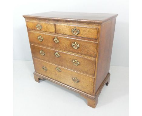 A Georgian oak chest of two short and three long drawers, with bracket feet. 94x93x53cm. 