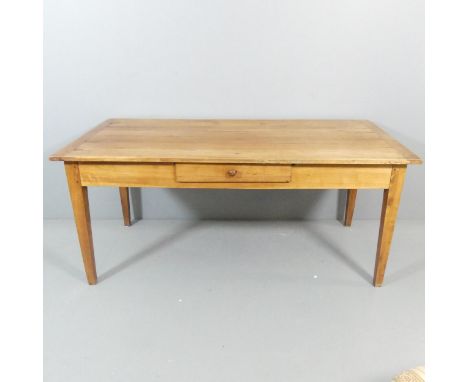 A French cherry wood plank top dining table, with single drawer and raised on square tapered legs. 168x73x81cm.Good used cond