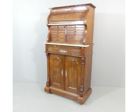 A Victorian burr walnut two-section dentist's cabinet, the top section having a cylinder top revealing a mirror above a marbl