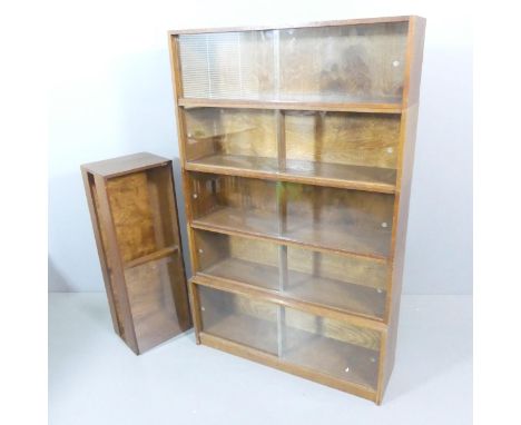 A mid-century oak five shelf sectional stacking Minty style bookcase with sliding glazed doors, by Phoenix Gallery, London, w