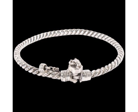An Eastern white metal torque rope twist bangle, with bolt clasp, W5.8mm, internal diameter 8cm 