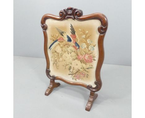 A Victorian mahogany firescreen with woolwork tapestry panel. 49x69cm. 