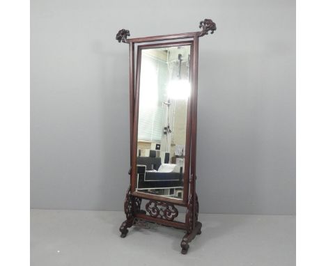 A modern Chinese hardwood cheval mirror, with applied carved decoration. Overall 86x175x40cm.Moulding to bottom rail is partl