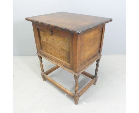 An early 20th century oak drinks / cocktail cabinet, with single fall front and barley twist legs. 61x73x45cm. 