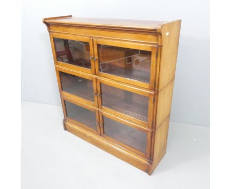 Minty An early 20th century mahogany three shelf sectional stacking bookcase. 89x98x26cm. 