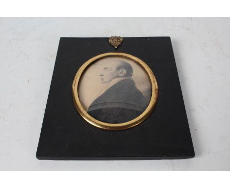 Victorian portrait miniature, depicting a gentleman in profile, housed in a gilt mount and ebonised frame with gilt oak leaf 