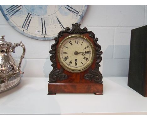 A 19th Century mahogany cased bracket clock, Roman numerated painted dial (later) and twin fusee mechanism, scrolled foliate 
