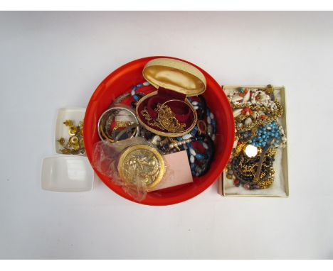 A quantity of costume jewellery including yellow metal chains, beads, compact etc