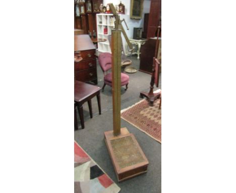 A mahogany set of doctor's weighing scales with upholstered platform and brass measure a/f