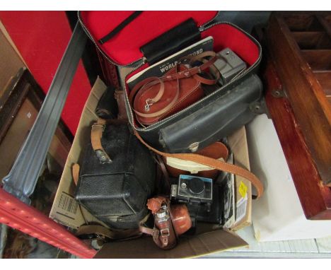 A quantity of cameras and binoculars including Kodak Polaroid 