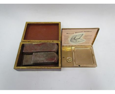 A box of marble hieroglyphic seals and a Thorens mother-of-pearl musical compact