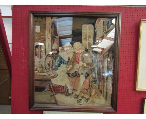 A framed and glazed tapestry depicting a husband and wife, 69cm x 60cm