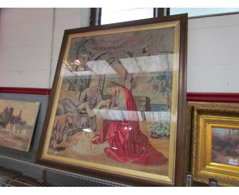A large framed and glazed tapestry depicting a religious scene, 87cm x 77cm