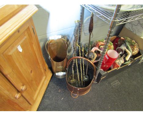 A copper coal bucket, a scuttle with lion head castings and porcelain handles, together with various fire tools including a s