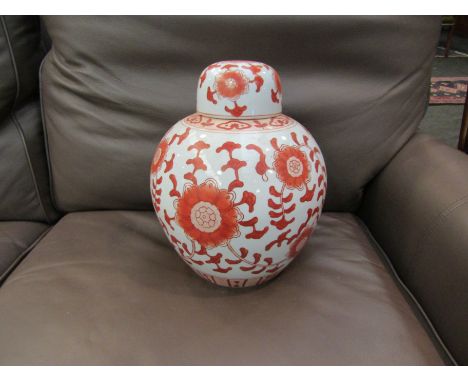 A 20th Century ceramic decorative bulbous ginger jar with lid, red floral decoration, 32cm tall