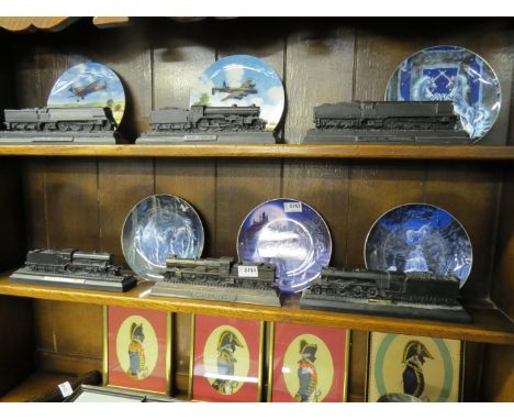 Six model train locomotives, some carved from coal       