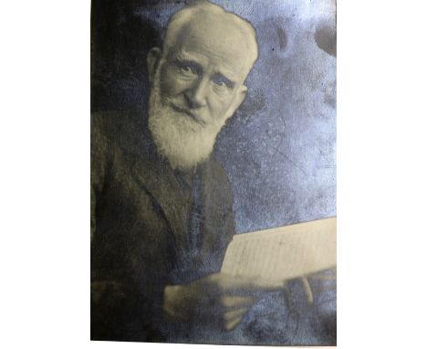 Photographs: Good half length Portrait George Bernard Shaw, looking right, holding an open book, approx. 6 1/4" x 4 1/2", unf