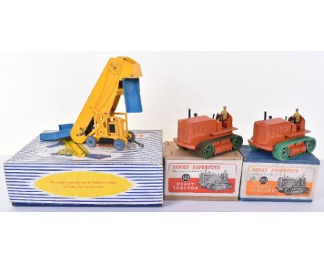 Three Boxed Dinky Supertoys, 563 Heavy Tractor, orange body, tan driver, original rubber tracks, in buff lidded box, with inn