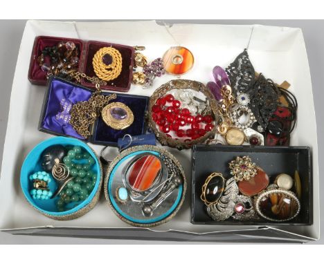 A box of Victorian and later costume jewellery including amethyst brooches, banded agate and enamelled pieces etc.