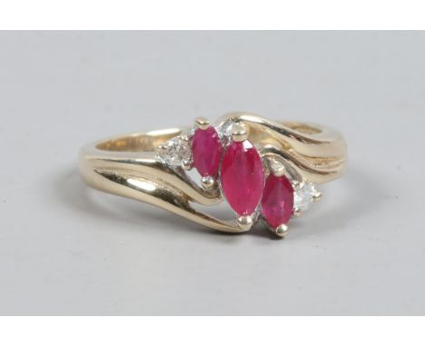 A 9ct gold ruby and diamond crossover ring, size K.