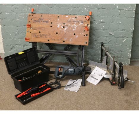 A Black & Decker workmate 700 folding bench with heavy duty Hahher drill and manual, Nobex mitre saw, along with a tool box a