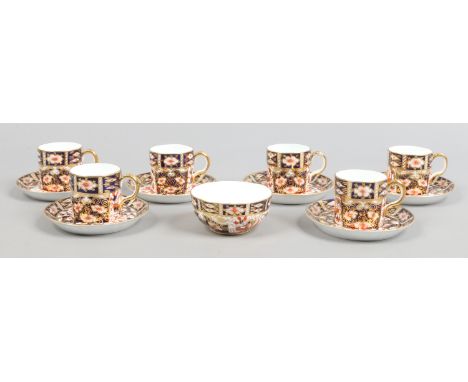 Six Royal Crown Derby Imari coffee cups and saucers and a sugar bowl.