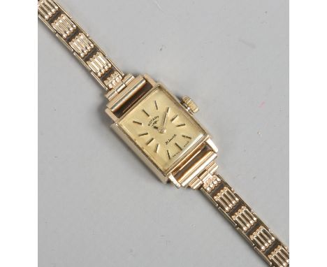 A ladies 9ct gold Rotary manual bracelet watch with rectangular dial having applied baton markers case and strap gross weight