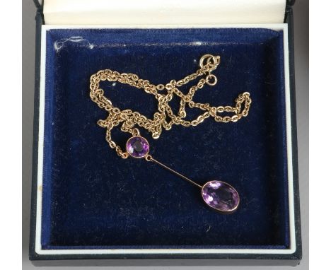A 9ct gold and two stone amethyst drop pendant on chain, gross weight 5.39 grams.