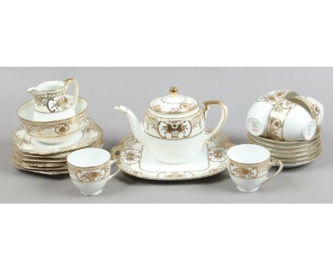 A Noritake six place tea service decorated with gilt decoration 22 pieces made in Japan.