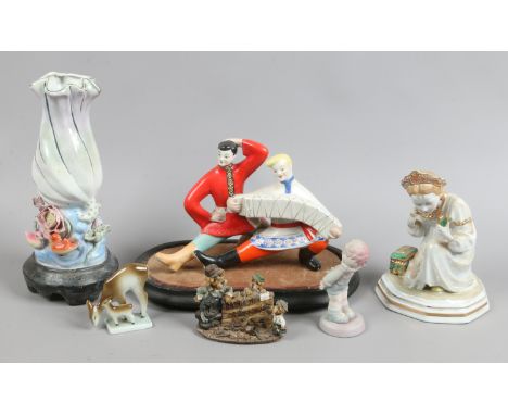 A Russian porcelain figure modelled as a pair of Kosak dancers, a Zsolnay Pecs model of a deer, along with other ornaments.