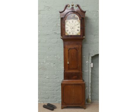 A George III oak mahogany and yew wood longcase clock. Housing an eight day movement striking on a bell. With painted arch to