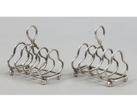 A pair of early C20th silver toast racks by Harrison Brothers & George Howson, assayed Sheffield 1929. total weight 136.8 gra