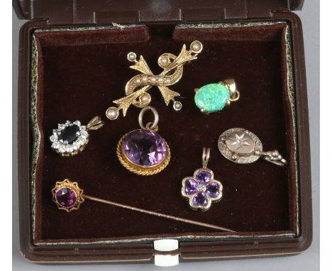 A 14ct gold and seed pearl cruciform brooch, an amethyst set stick pin, 14ct gold opal effect pendant, 9ct gold pendant and t