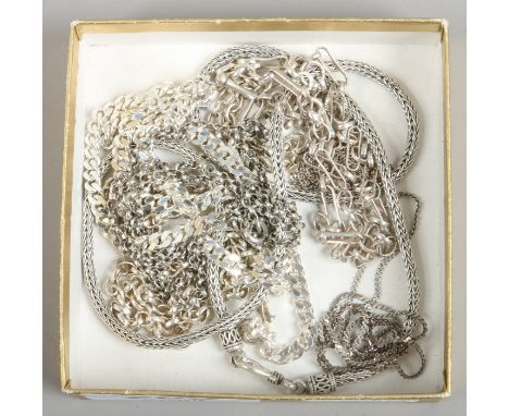 Seven silver chains including a snake chain and a curb chain.