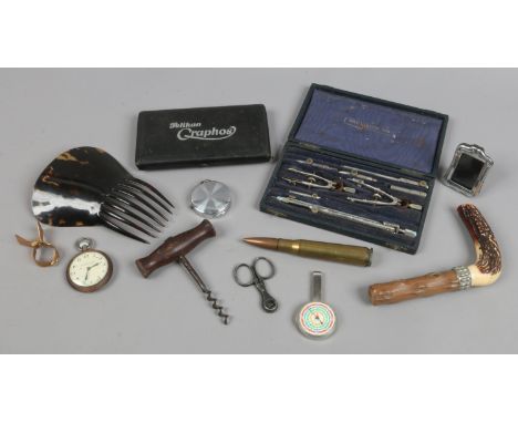 A box of collectables, drawing related, corkscrew, walking stick handle, pocket watch etc.