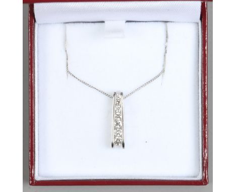 An 18ct white gold Iliana seven stone diamond pendant on chain, approximately 0.33ct total, 3.82 grams total.
