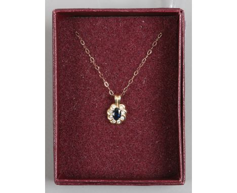 A 14ct gold sapphire and diamond pendant on 9ct gold trace chain.