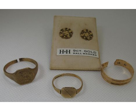 Collection of gold jewellery comprising a pair of pierced 9ct gold earrings, two 9ct gold signet rings (cut) and an 18ct gold